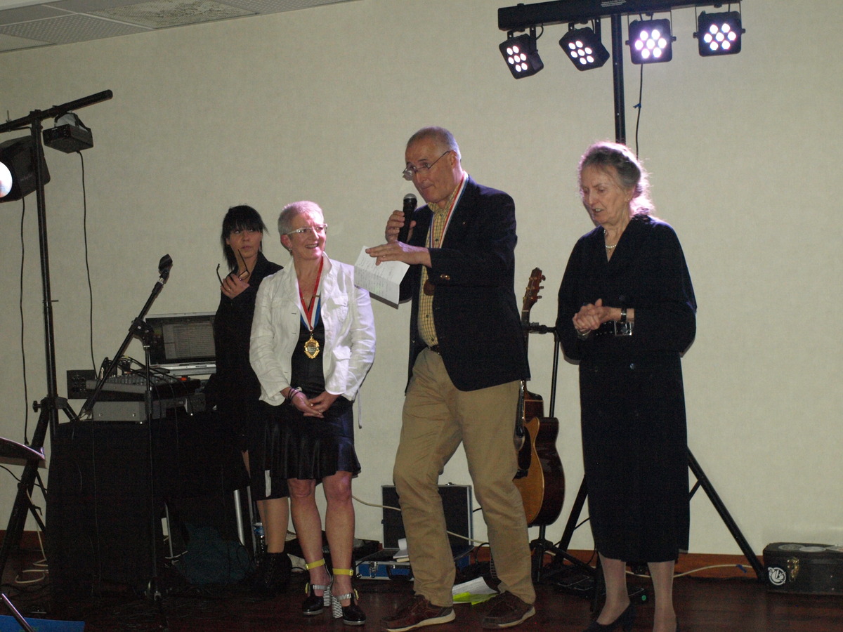 Professional singer (far left) looks alarmed as Phil attempts La Marseillaise ......